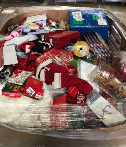 Christmas pallet with baubles, string lights, and holiday decorations